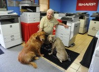 Scott Althaus with his two dogs (Credit: JASON CLARK/EBJ) 