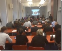 Delegates watching a presentation at the event