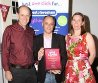 Cartridge World Evesham's Richard and Penny Jones being presented with their Best of Evesham award