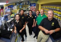 Enrique Yunis (second from right) and Francisco Garrido (right) with the Cartridge World Miami team. Credit Roberto Koltun, El Nuevo Herald