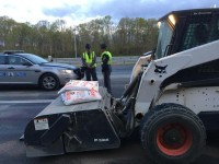 Workmen clearing the inkjet spill (Credit: Kristi King/WTOP)