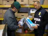 Authorities with seized counterfeit products (Credit: Rete8.it)